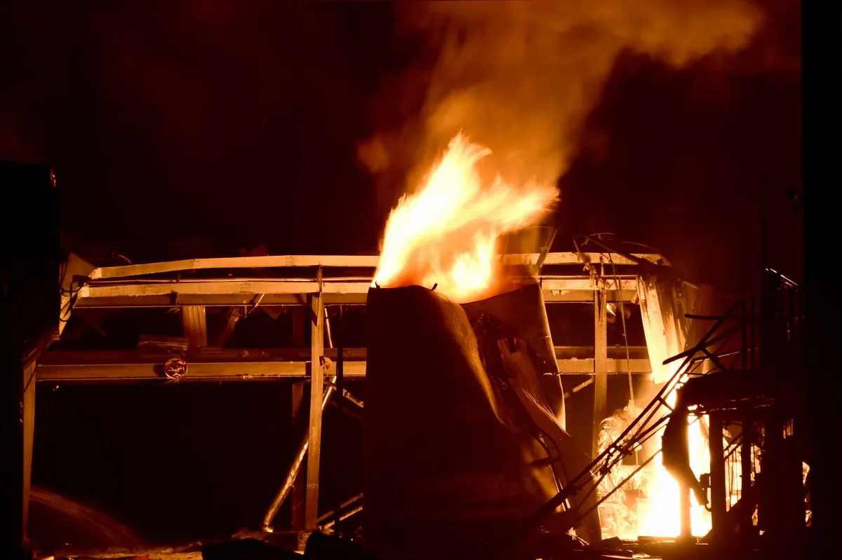 A chemical plant of Shandong Runxing Chemical Technology Co. is on fire following an explosion in Zibo, east China's Shandong Province, Sunday, Aug. 23, 2015. (Guo Xulei/Xinhua via AP) 