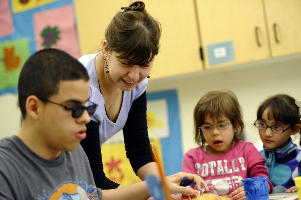 LIFESTYLE-US-ART-HEALTH-CHILDREN BY BRIGITTE DUSSEAU Bojana Coklyat with Omar Tzic, Star Almonte and Xiomara Torres at the Concordia Learning Center at St. Joseph?s School for the Blind in Jersey City, New Jersey April 23, 2012. The art class taught by artist Bojana Coklyat of Jersey City, who became a volunteer art teacher at Concordia after she started losing her eyesight from diabetes. AFP PHOTO / TIMOTHY A. CLARY (Photo credit should read TIMOTHY A. CLARY/AFP/GettyImages)