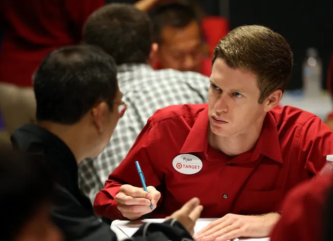 A Target employee interviews a job seeker during a job fair at a Target retail store in San Francisco on Aug. 15, 2013. (Justin Sullivan/Getty Images)