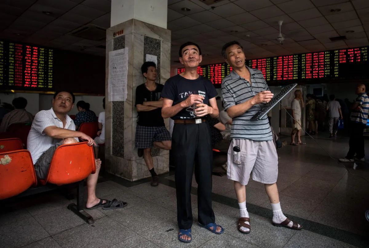 Investors monitoring stock market movements at a brokerage house in Shanghai on Aug. 18, 2015. (Johannes Eisele/AFP/Getty Images)