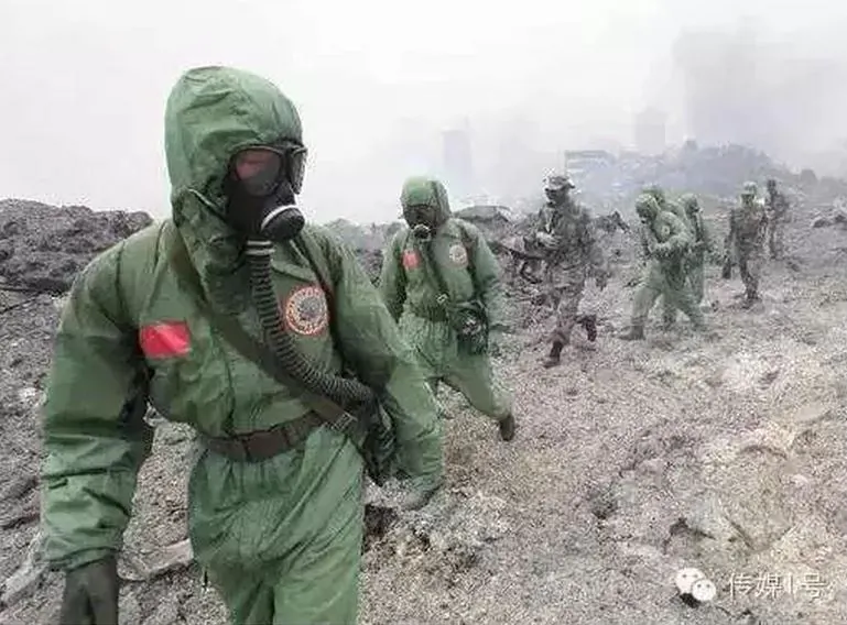 Rescuers in hazmat suits at the site of the explosions in Tianjin, China, in this undated photo. (Liu Yanmin/WeChat)