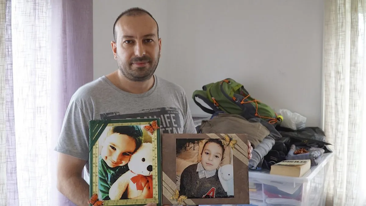 In this photo taken Friday, May 11, 2015, Feridun Mustafaoglu  hold pictures of his children  in his small one-room rental during an interview with The Associated Press, in Stavanger, Norway. Mustafaoglu helped his wife and two sons flee to Turkey after a tip-off that Norwegian child protection services were about to take custody of the children. After a series of highly charged custody disputes, Norway now faces accusations of cultural insensitivity at best and child theft at worst, as increasing numbers of immigrant children are being seized by officials and handed over to Norwegian foster families. (AP Photo/David Keyton)