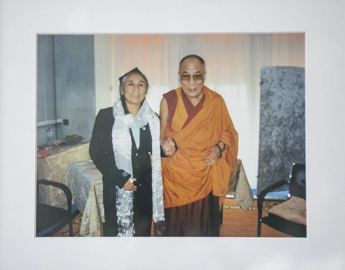 Rebiya Kadeer, President of the World Uyghur Congress with His Holiness the Dalai Lama in a photograph at her home. (Samira Bouaou/Epoch Times)