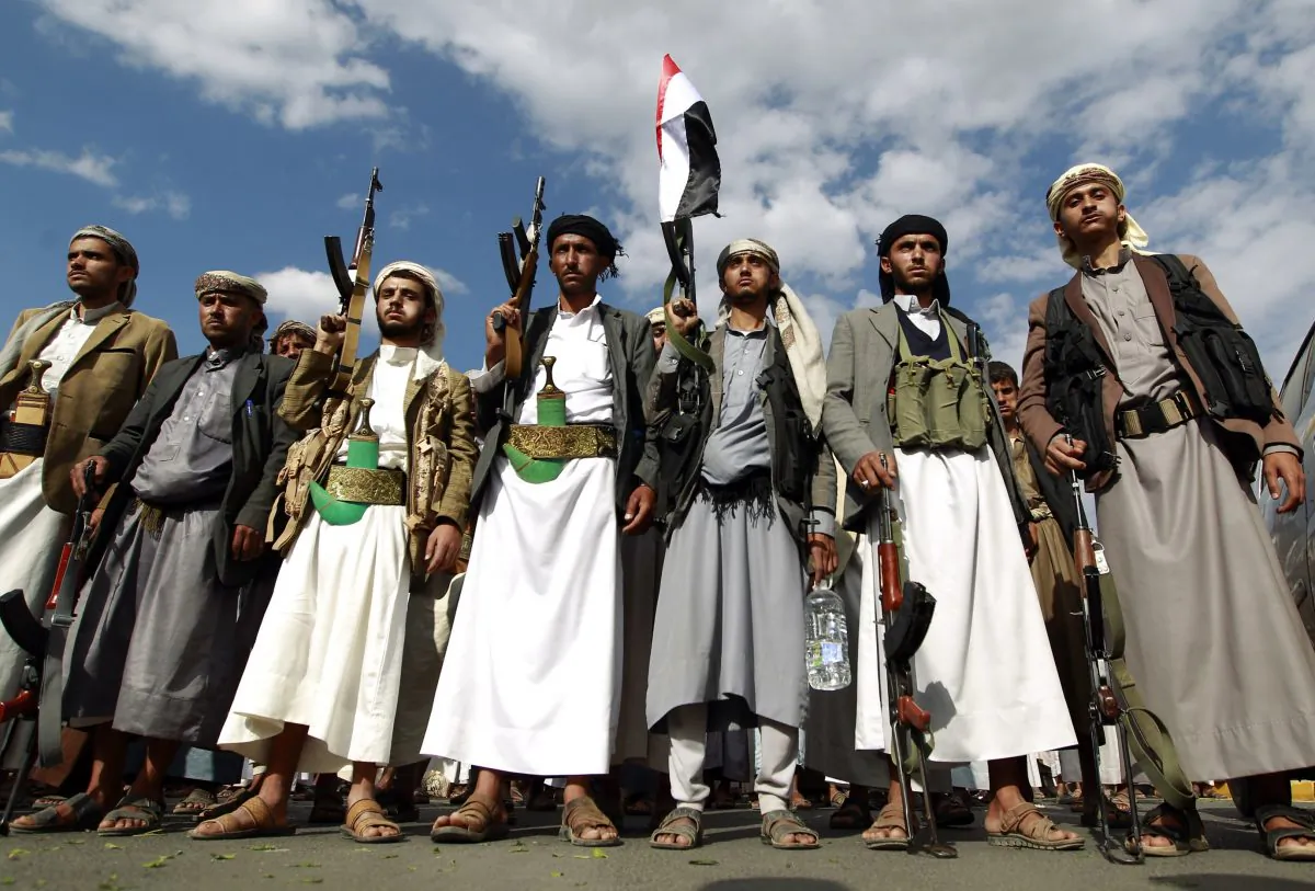 Yemeni supporters of the Shiite Huthi rebel movement raise their weapons during a rally to protest against a military offensive by a Saudi-led coalition, on August 24, 2015 in the capital Sanaa. (Mohammed Huwais/AFP/Getty Images)