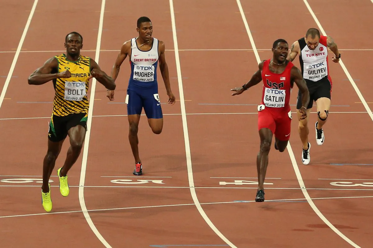 Usain Bolt of Jamaica crosses the finish line to win gold ahead of Justin Gatlin (2nd R) of the United States in the Men's 200 metres final during day six of the 15th IAAF World Athletics Championships Beijing 2015 at Beijing National Stadium on August 27, 2015 in Beijing, China. (Patrick Smith/Getty Images)