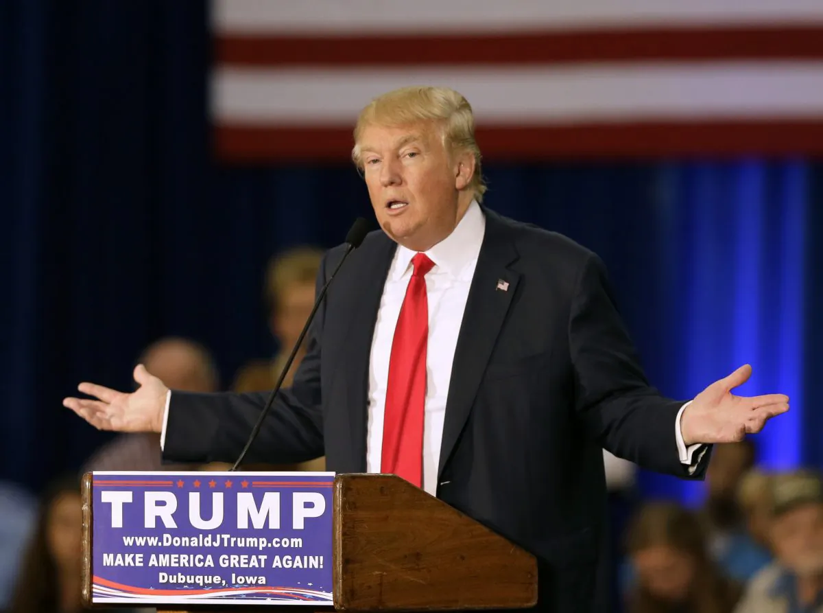 In this Aug. 25, 2015 file photo, Republican presidential candidate Donald Trump speak in Dubuque, Iowa. Not only is Trump an unconventional candidate, he's got a campaign operation that turns the conventional wisdom of electoral politics on its head. (AP Photo/Charlie Neibergall)