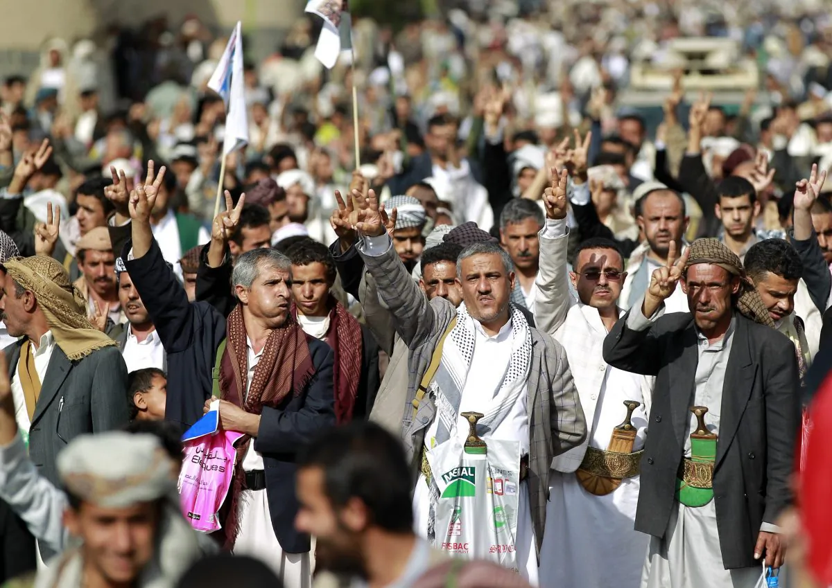 Yemeni supporters of the Shiite Huthi rebel movement, some of them chewing Qat, a mild drug used daily by many Yemenis, raise their weapons during a rally to protest against a military offensive by a Saudi-led coalition, on August 24, 2015 in the capital Sanaa.(Mohammed Huwais /AFP/Getty Images)