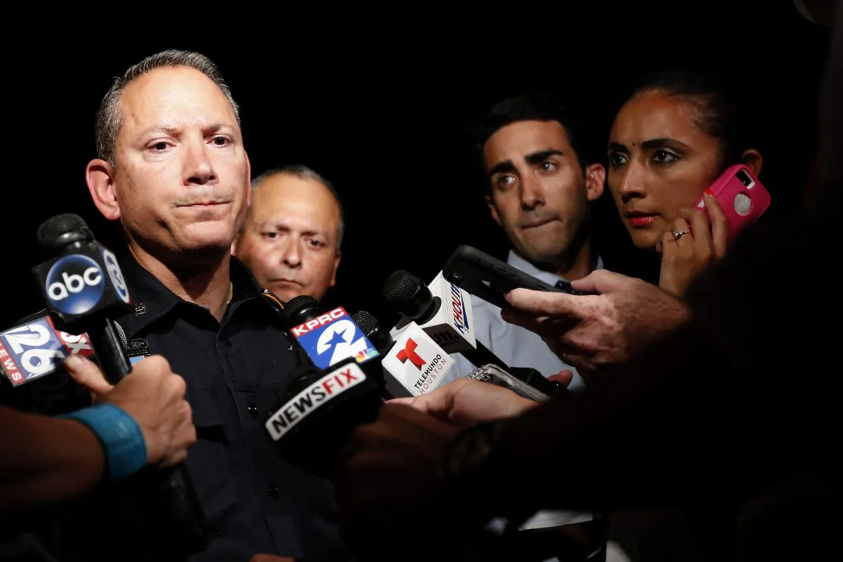 Harris County public information officer Thomas Gilliland speaks to the media after a sheriff's deputy in uniform was fatally shot Friday, Aug. 28, 2015, in Houston. (Karen Warren/Houston Chronicle via AP) MANDATORY CREDIT