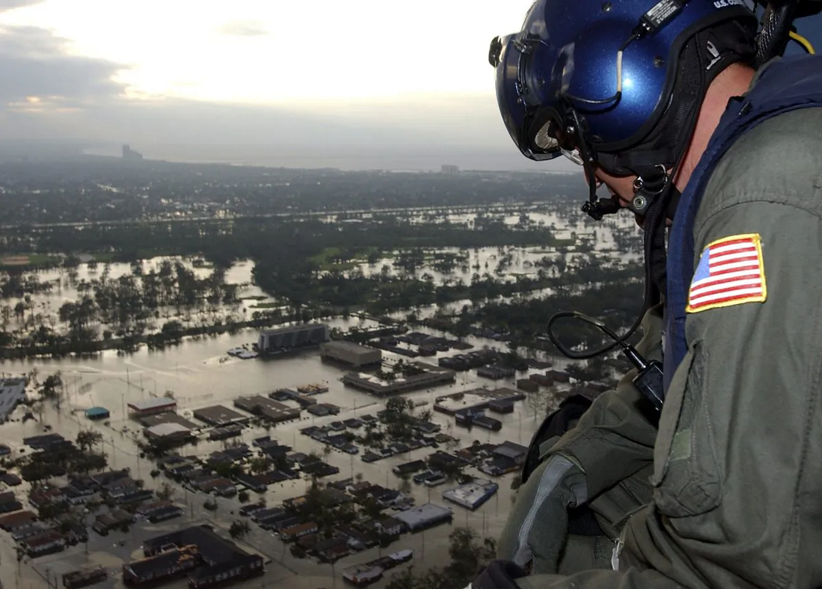 Coast Guard Petty Officer 1st Class Steven Huerta searches for citizens in distress after Hurricane Katrina, in New Orleans, Louisiana, on Aug. 29, 2005. (Kyle Niemi/U.S. Coast Guard via Getty Images)