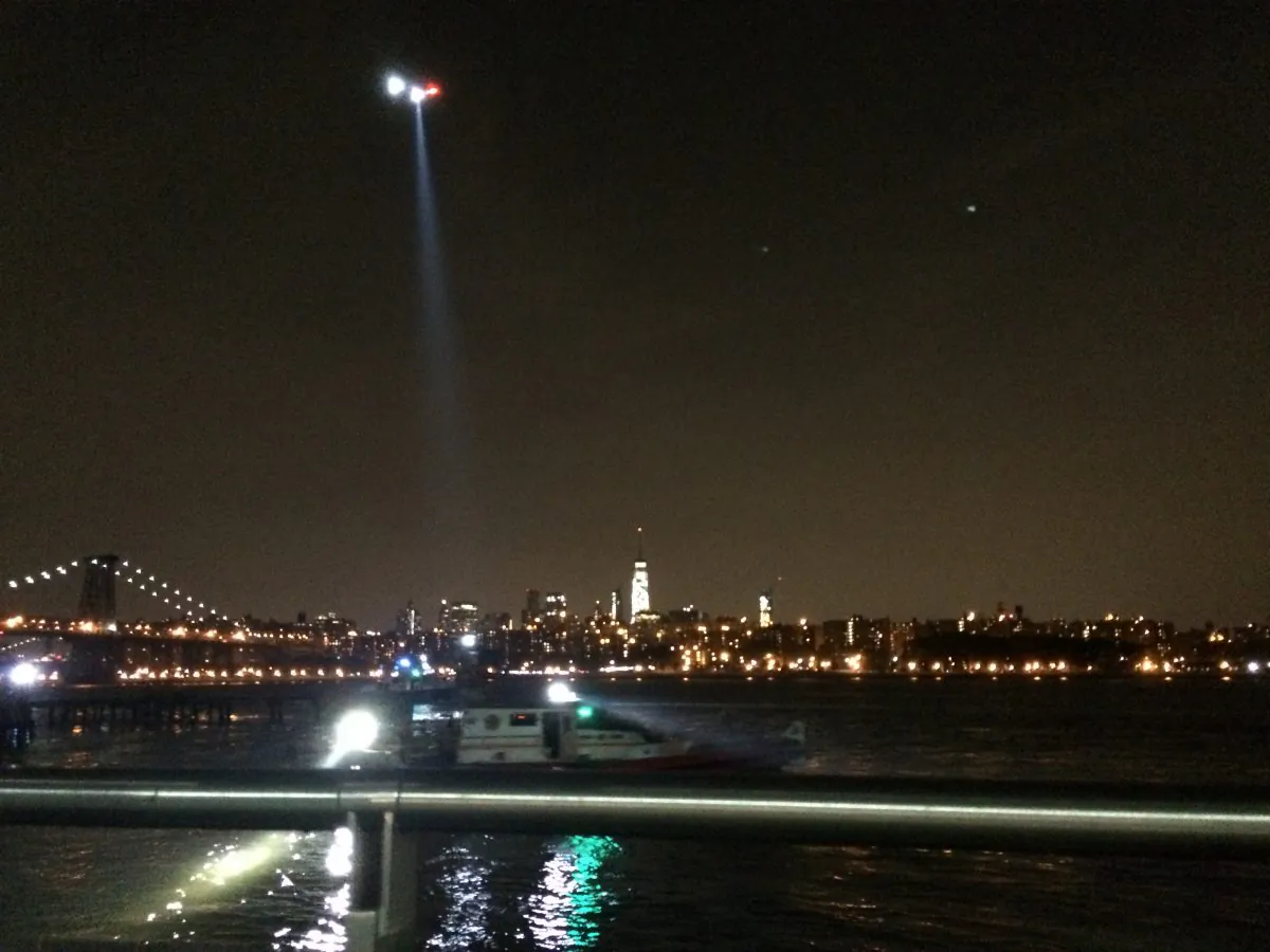 A helicopter searches for the body of a woman who jumped into the East River during the early hours of Aug. 30, 2015. (Courtesy of Seth Hirsch)