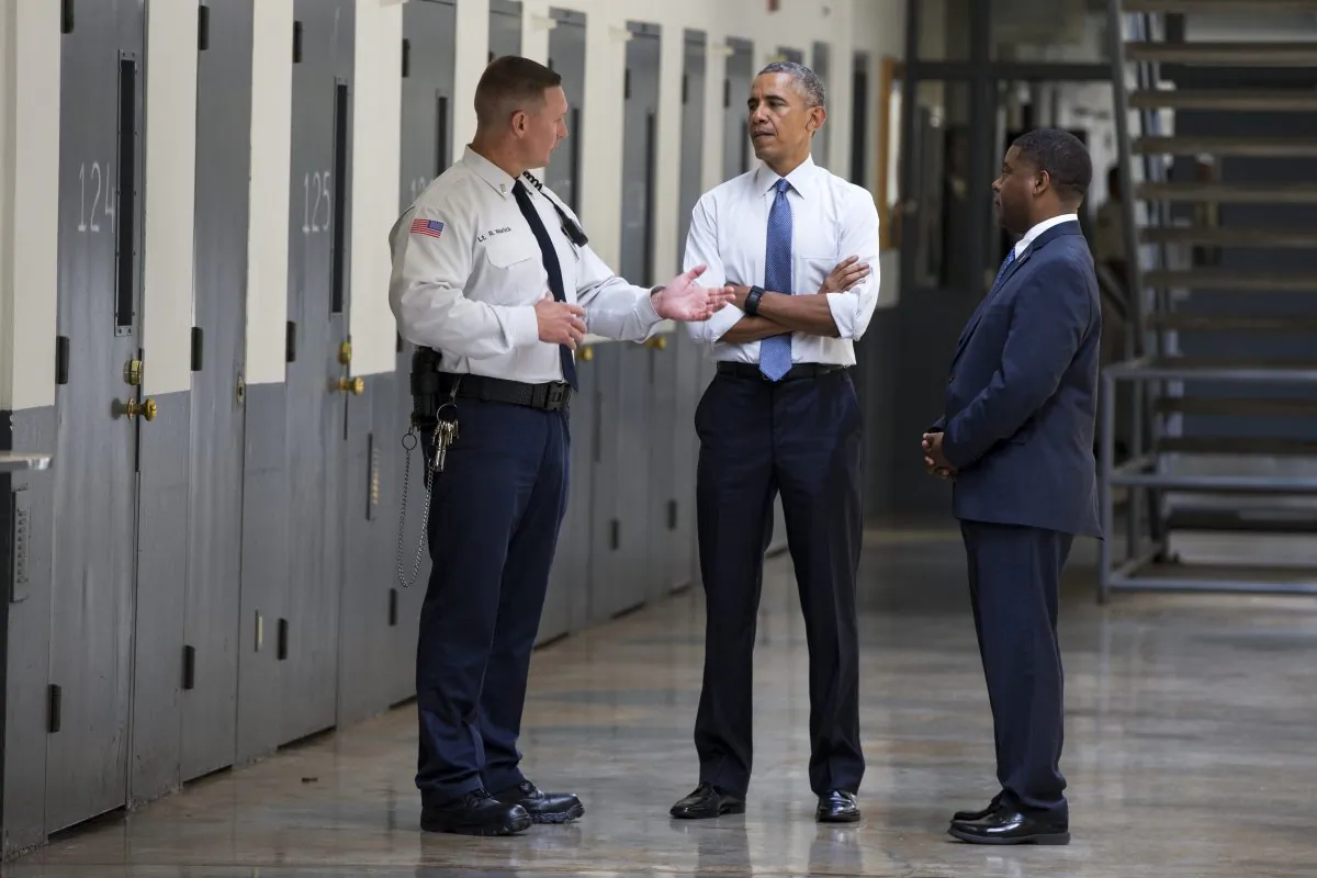 President Barack Obama is led on a tour by Bureau of Prisons Director Charles Samuels (R) and Correctional Officer Ronald Warlick (L) during a visit to the El Reno Federal Correctional Institution, in El Reno, Okla., on July 16, 2015. (Evan Vucci/AP)