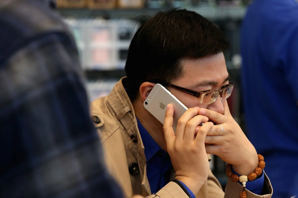 A Chinese man answers the phone with his new iPhone 6 Plus inside an Apple store on October 17, 2014 in Beijing, China. Apple Inc began delivering its popular smartphone iPhone6 and iPhone6 Plus to the Chinese mainland on Friday. (Feng Li/Getty Images)