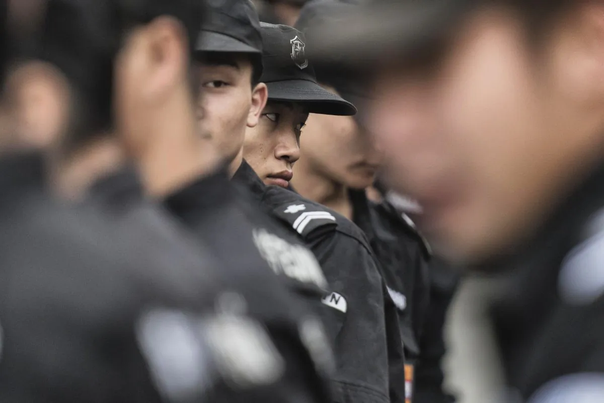 Chinese security stand in Tiananmen Square in Beijing on Aug. 30, 2015. (Fred Dufour/AFP/Getty Images)