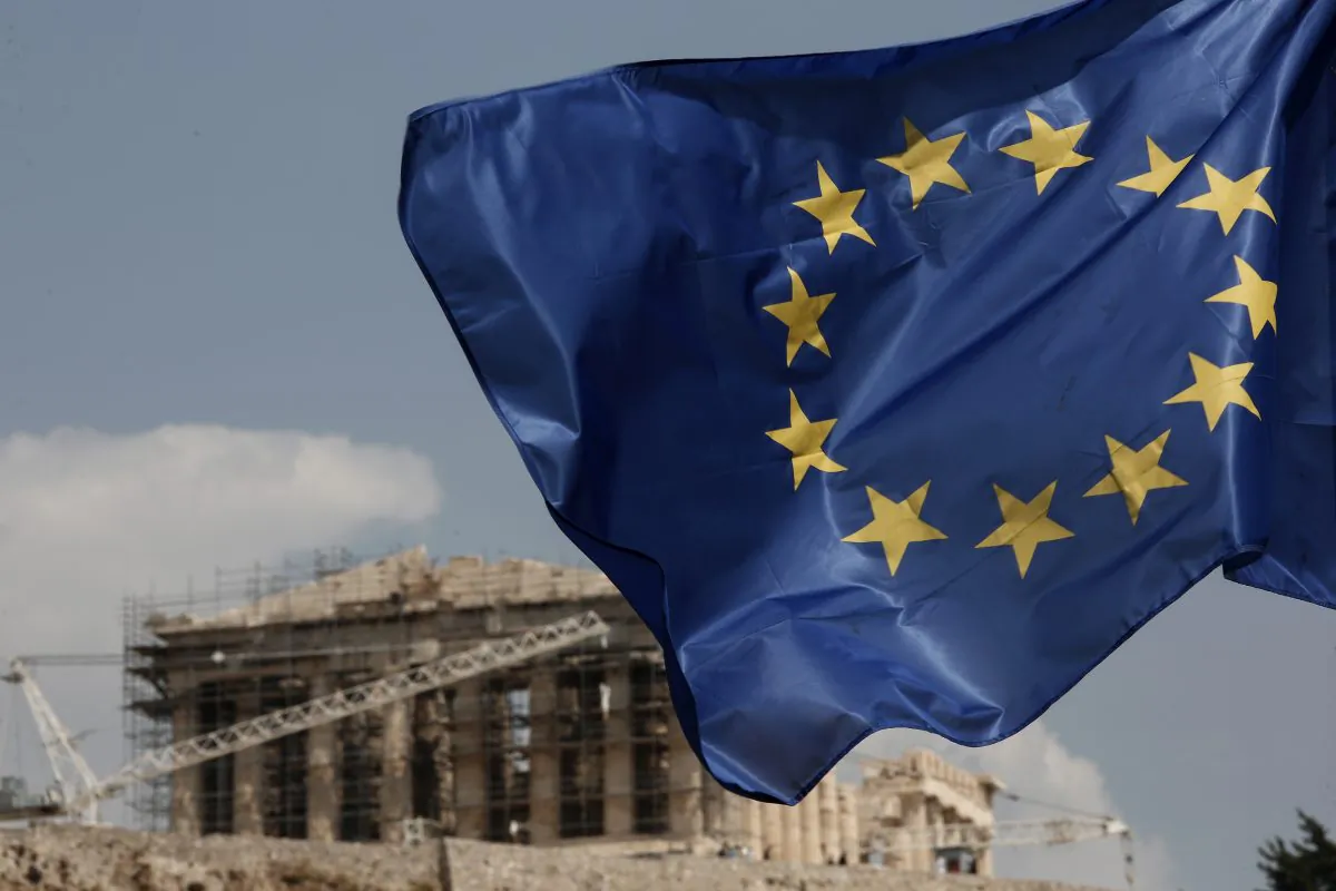 A European Union (EU) flag flutters in front of the temple of the Parthenon in Athens, Greece, on Aug. 15, 2015. (Yorgos Karahalis/AP)