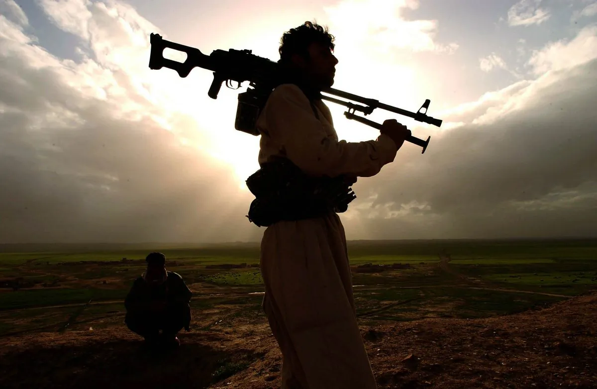 Kurdish Peshmerga fighters in the frontline of Kirkuk near Qoshtapa, Erbil, Iraq, on March 19, 2003. (Patrick Barth/Getty Images)