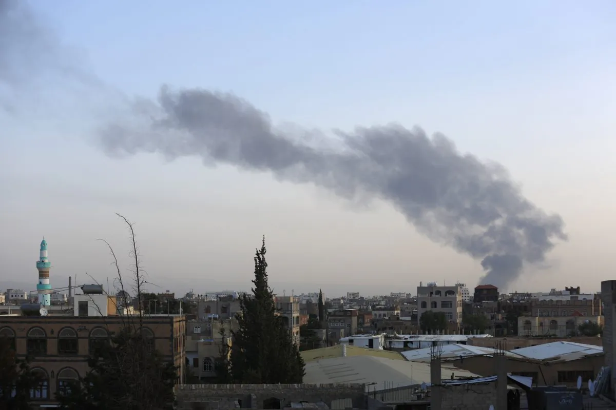 Smoke rises after an airstrike by the Saudi-led coalition at an army base in Sanaa, Yemen, Wednesday, Sept. 2, 2015. (AP Photo/Hani Mohammed)