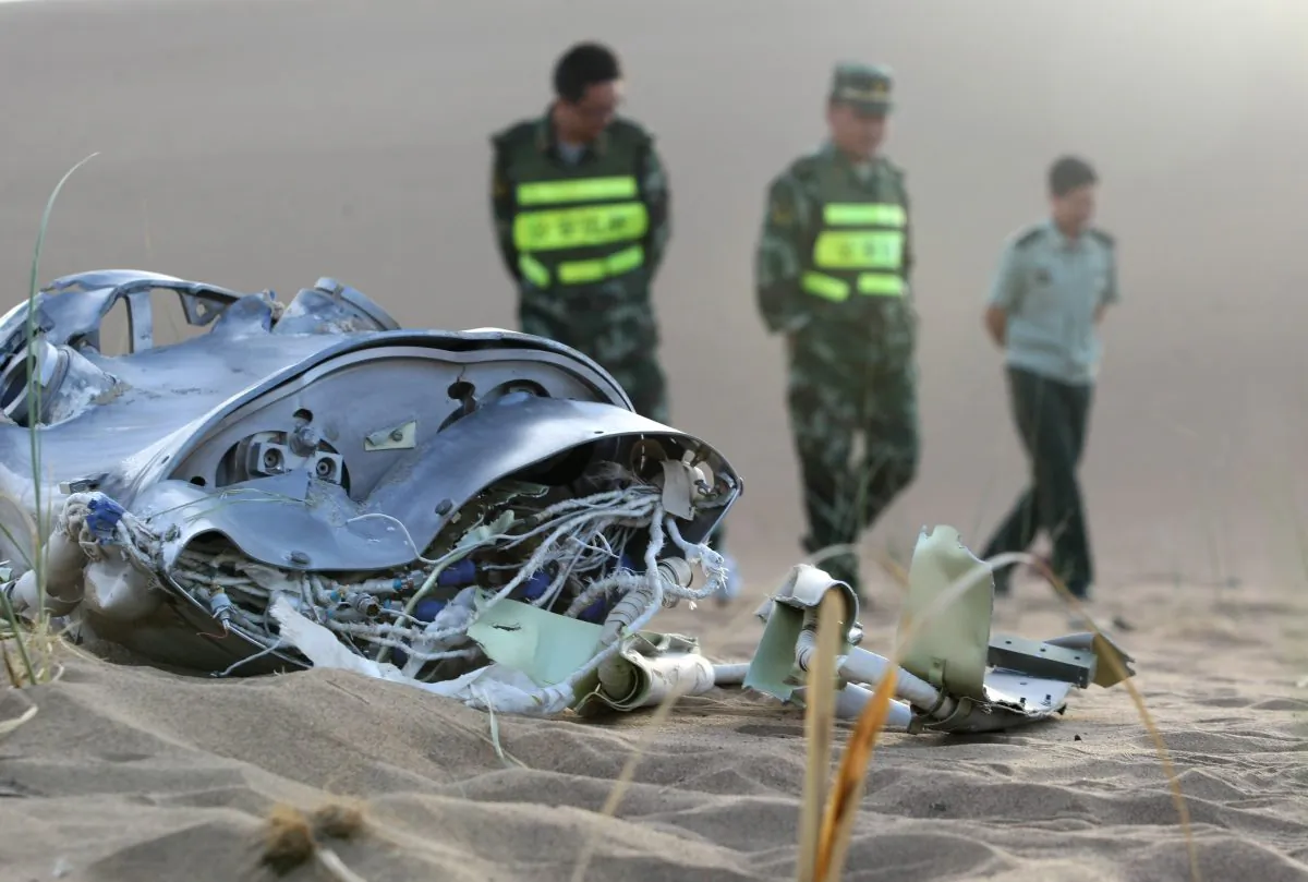 Remains from a Chinese space launch are left in the Badain Jaran Desert on June 12, 2013, in Alxa League, Inner Mongolia Autonomous Region of China. The Chinese regime is making a push to defense space-based weapons. (ChinaFotoPress/Getty Images)
