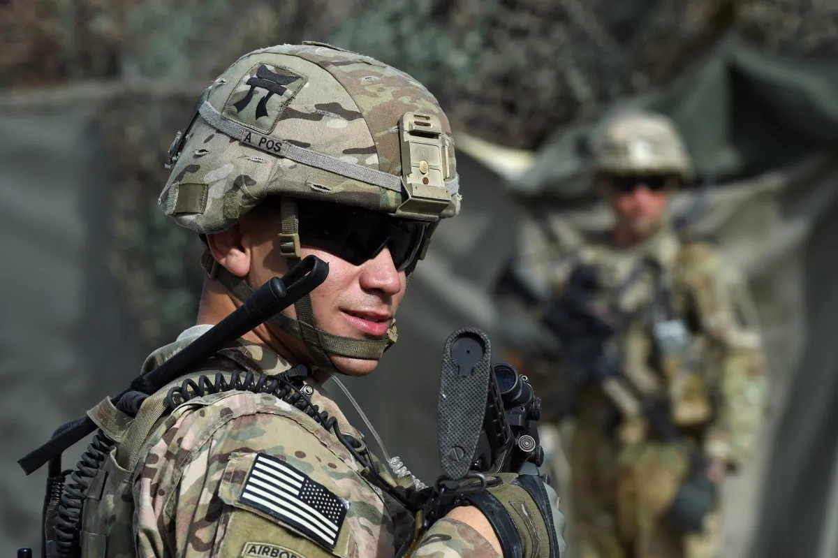 TO GO WITH AFGHANISTAN-US-ARMY-CONFLICT-FOCUS BY GUILLAUME DECAMME

In this photograph taken on August 12, 2015, a US army soldier stands guard at an Afghan National Army (ANA) base in the Khogyani district in the eastern province of Nangarhar. From his watchtower in insurgency-wracked eastern Afghanistan, US army Specialist Josh Whitten doesn't have much to say about his Afghan colleagues. "They don't come up here anymore, because they used to mess around with our stuff. "Welcome to Forward Operating Base Connelly, where US troops are providing training and tactical advice to the 201st Afghan army corps as they take on the Taliban on the battlefield. AFP PHOTO / Wakil Kohsar        (Photo credit should read WAKIL KOHSAR/AFP/Getty Images)