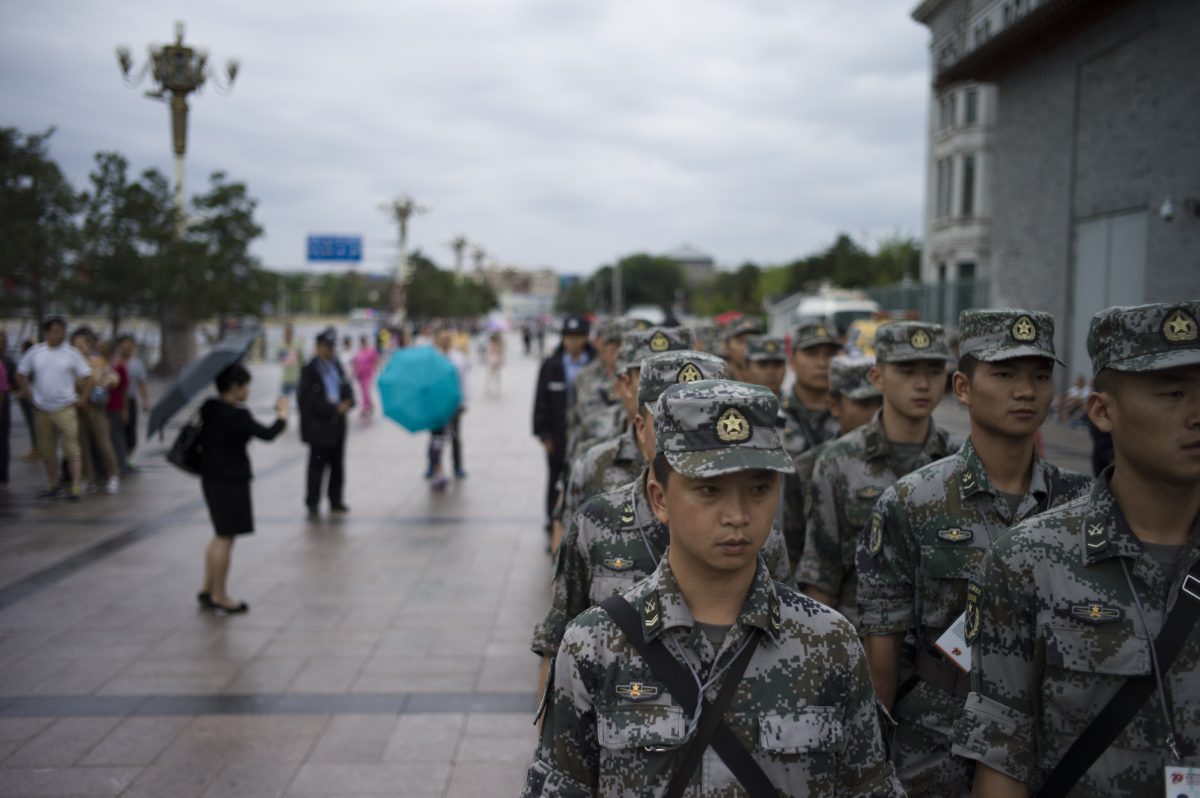 Members of the People’s Liberation Army stand in Beijing on Sept 1, prior to a planned Sept. 3 military parade. The parade will showcase many weapons systems the Chinese regime plans to sell. (Fred Dufour/AFP/Getty Images)