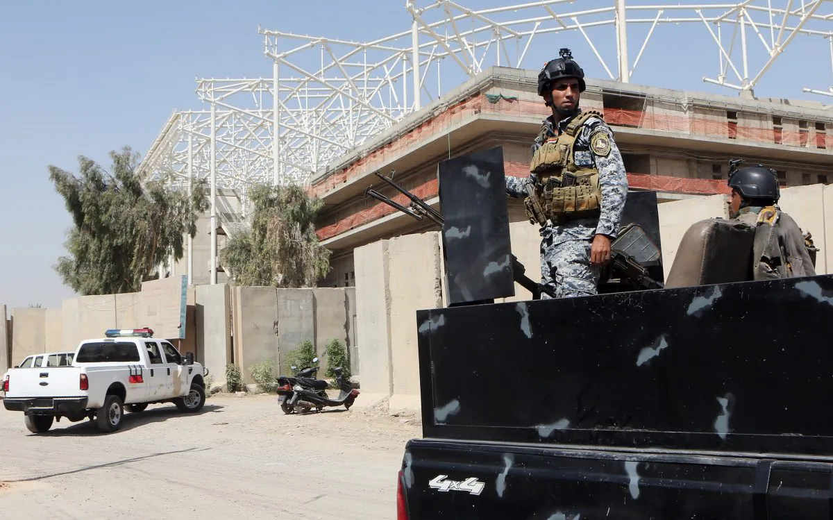 Iraqi security forces guard the entrance to a sports complex being built by a Turkish construction company, in the Shiite district of Sadr City, Baghdad, Iraq, Wednesday, Sept. 2, 2015. (AP Photo/Khalid Mohammed)