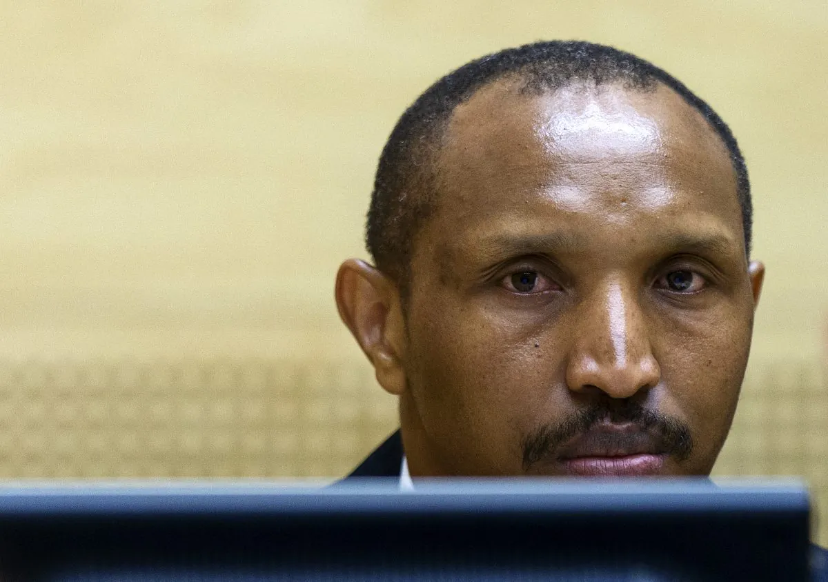 Bosco Ntaganda, a Congo militia leader known as The Terminator, waits for the start of his trial at the International Criminal Court on charges including murder, rape and sexual slavery allegedly committed in the eastern Ituri region of Congo from 2002-2003, in The Hague, Netherlands, Wednesday, Sept. 2, 2015. (Michael Kooren/Pool Photo via AP)