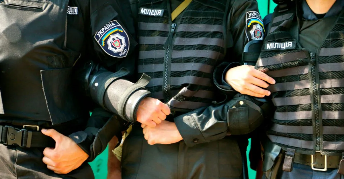Police in riot gear brace to hold back protesters. (Nolan Peterson/The Daily Signal)