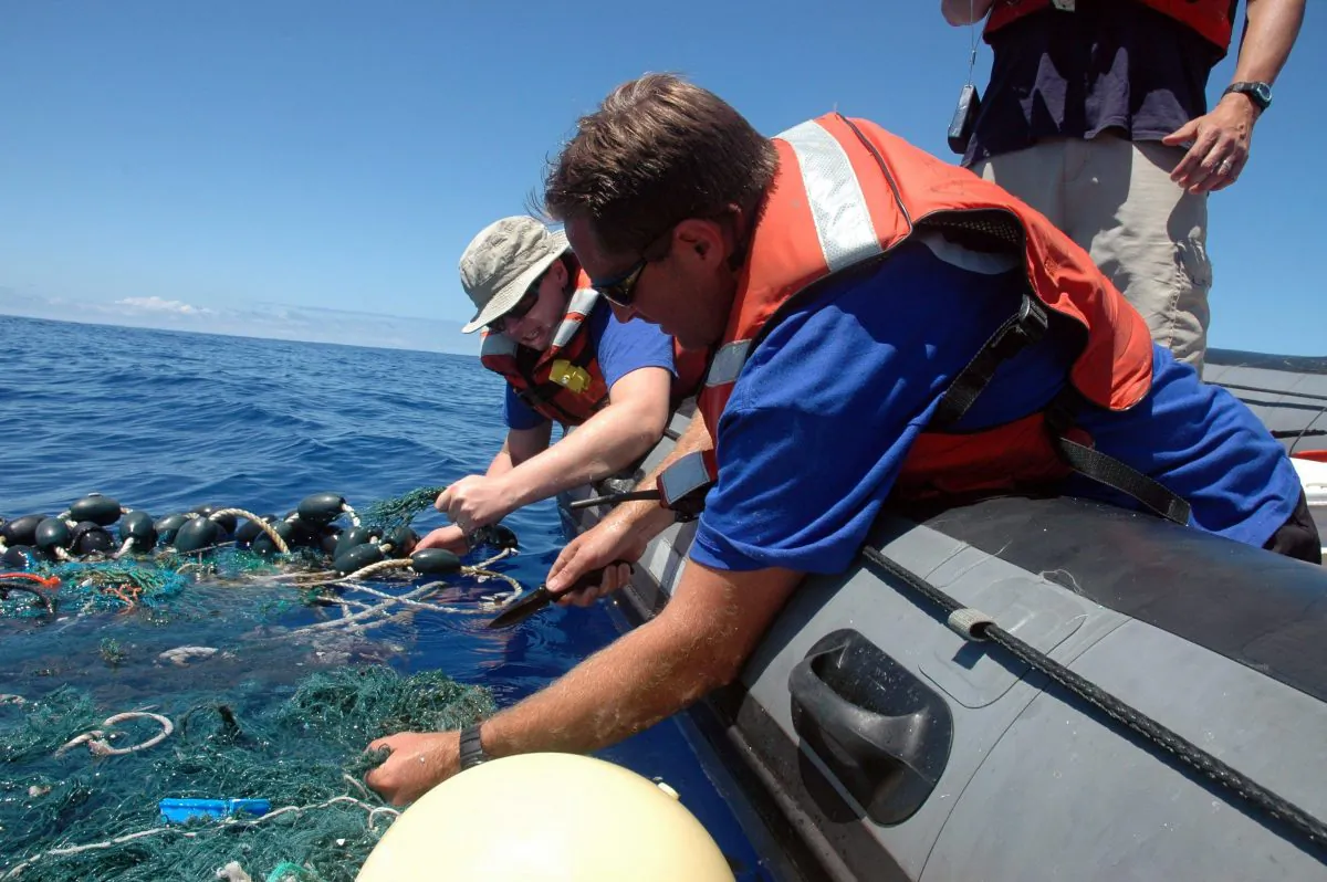 Workers with the Scripps Institution of Oceanography collect sea garbage in the Pacific Ocean. Discarded plastics often end up in the ocean, creating coastal pollution that harms marine life and gathers out at sea in what's become known as the Great Pacific Garbage Patch. (AP Photo/ Scripps Institution of Oceanography, Mario Aguilera, File)