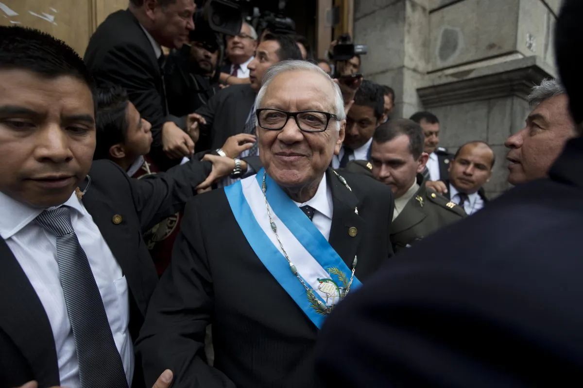 Guatemala's new President Alejandro Maldonado leaves the Congress building after his swearing-in ceremony in Guatemala City, Thursday, Sept. 3, 2015. Maldonado was sworn in amid a corruption scandal that has caused a national political crisis. The conservative former judge will serve out the term of former President Otto Perez Molina, who resigned late Wednesday after a judge issued an order for this detention. Prosecutors accuse the ex-president of leading a customs fraud ring. (AP Photo/Esteban Felix)