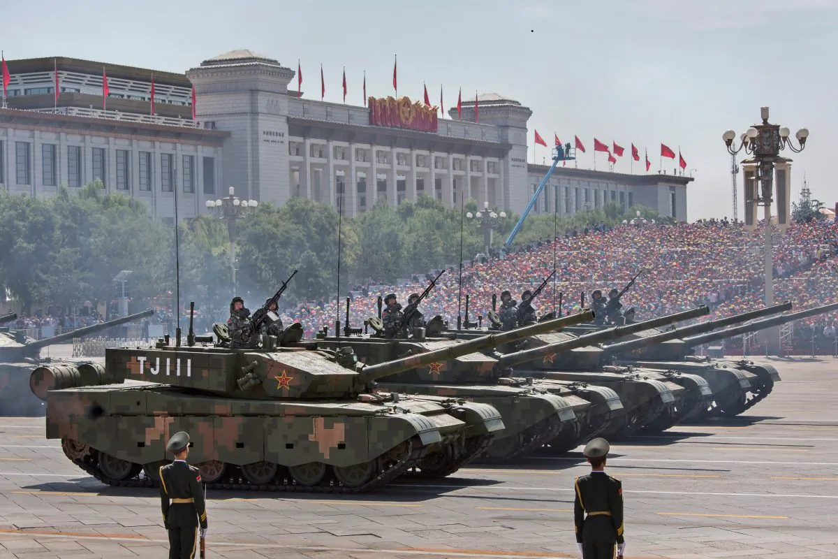 Chinese soldiers ride in tanks as they pass in front of Tiananmen Square during a military parade to mark the 70th year since the Allied victory in World War II in Beijing on Sept. 3, 2015. (Kevin Frayer/Getty Images)