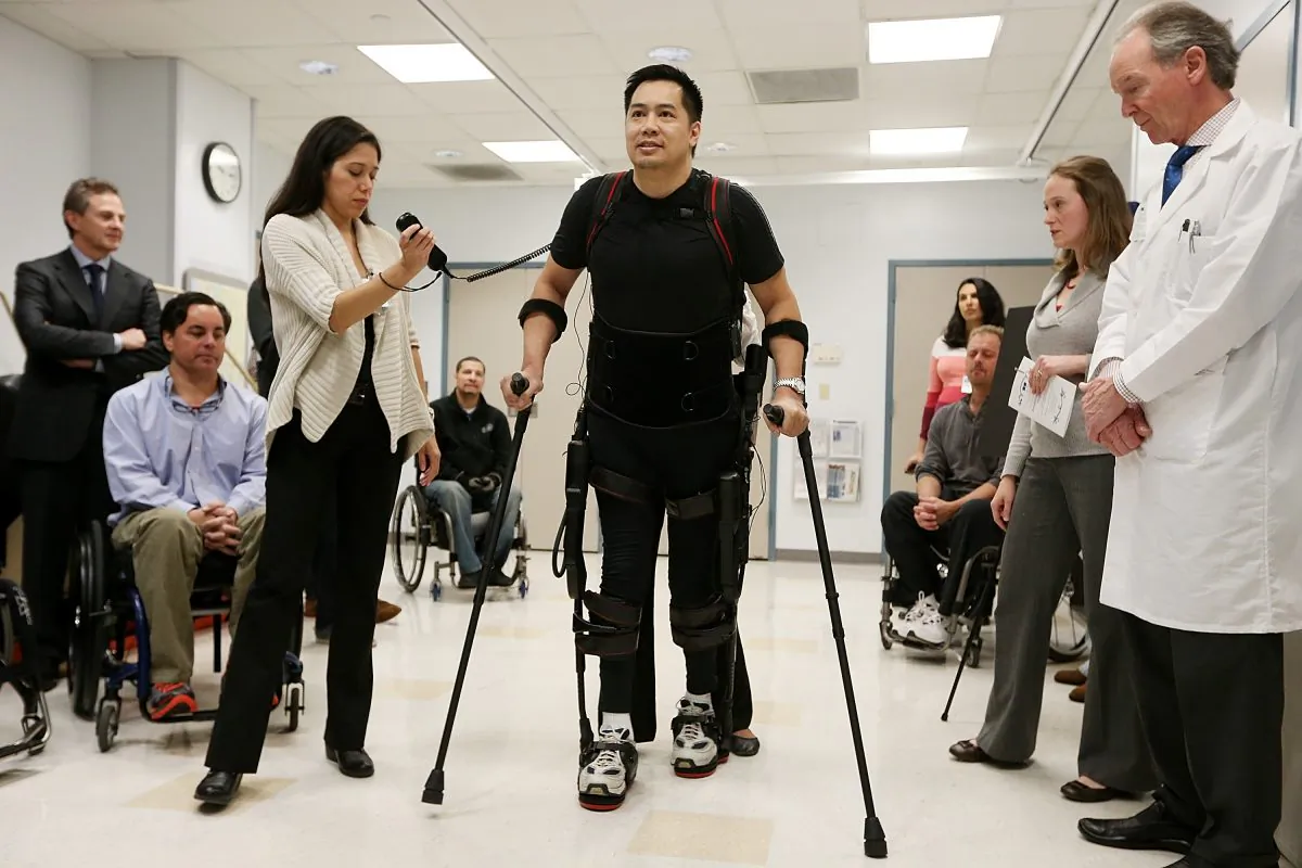 Forty three-year-old parapalegic Robert Woo walks with an exoskeleton device made by Ekso Bionics during a demonstration at the opening of the Rehabilitation Bionics Program at Mount Sinai Rehabilitation Center on December 6, 2012 in New York City. (Mario Tama/Getty Images)