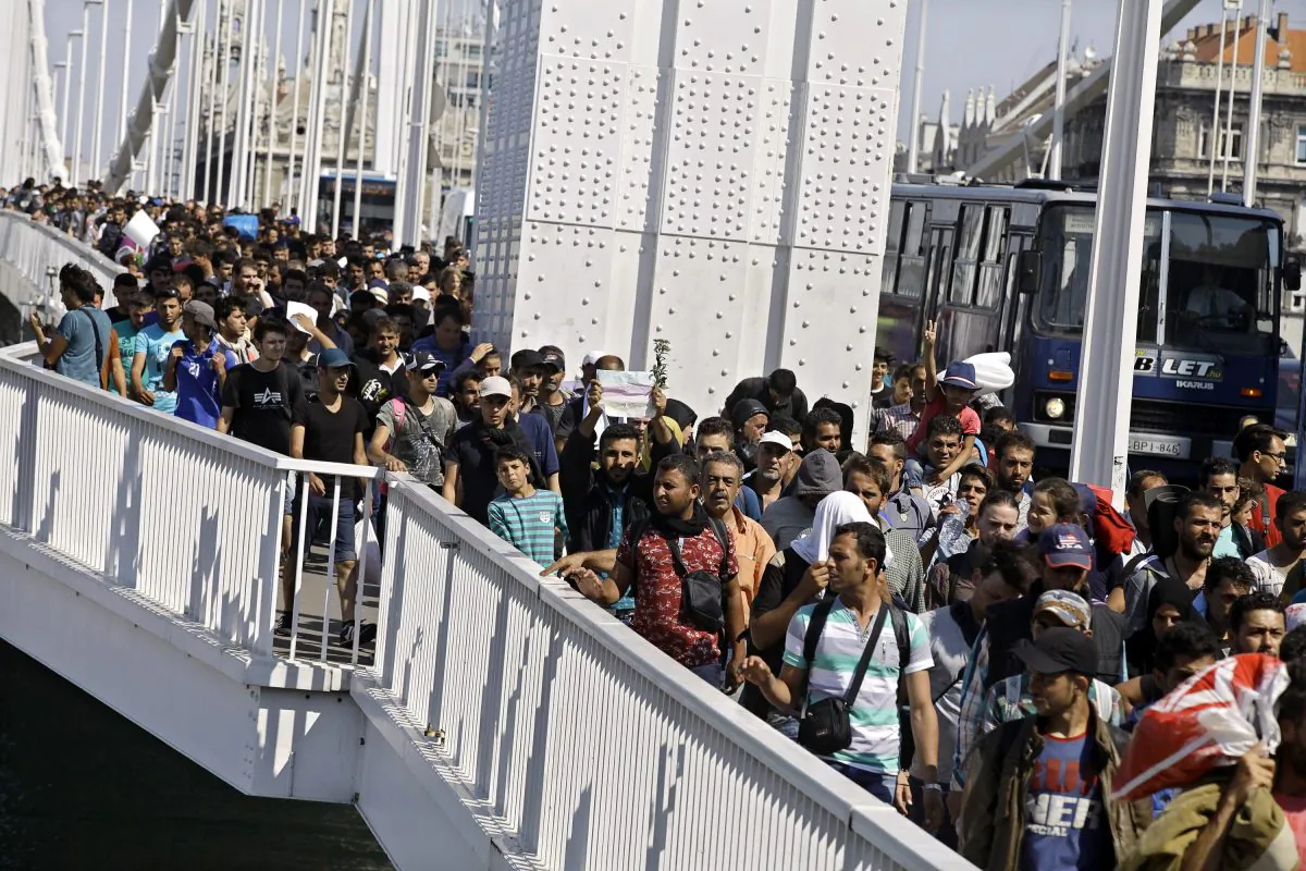Hundreds of migrants walking across Budapest after leaving the transit zone of the Budapest main train station, on September 4, 2015 intenting on walking to the Austrian border.(Peter Kohalmi/AFP/Getty Images)