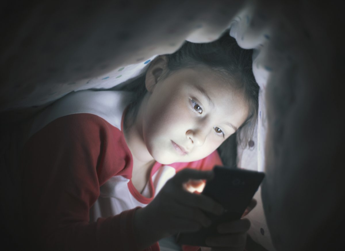 imiting screen time before bedtime is beneficial for sleep. (Dane/iStock.com)