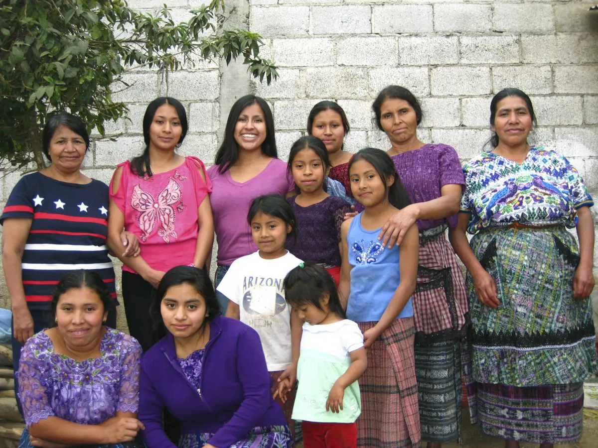 Gemma Givens- background third from left- with relatives in Santiago, Sacatepequez, Guatemala in March 24, 2012. (Courtesy of Gemma Givens via AP)