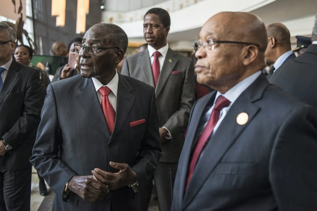 Zimbabwean President and Chairperson of the African Union Robert Mugabe (L), Zambian President Edward Lungu (C), and South African president Jacob Zuma (R) arrive for the 25th African Union Summit in Sandton, Johannesburg, South Africa, on June 13, 2015. (Mujahid Safodien/AFP/Getty Images)