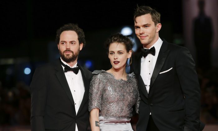 Drake Doremus, Kristen Stewart and Nicholas Hoult pose for photographers at the premiere of the film Equals during the 72nd edition of the Venice Film Festival in Venice, Italy, Saturday, Sept. 5, 2015.  (AP Photo/Andrew Medichini)