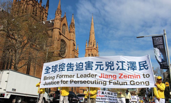 Falun Gong practitioners march in a parade in Sydney on Sept. 4, 2015, calling for an end to the persecution launched by the former Communist Party leader Jiang Zemin. (Epoch Times)