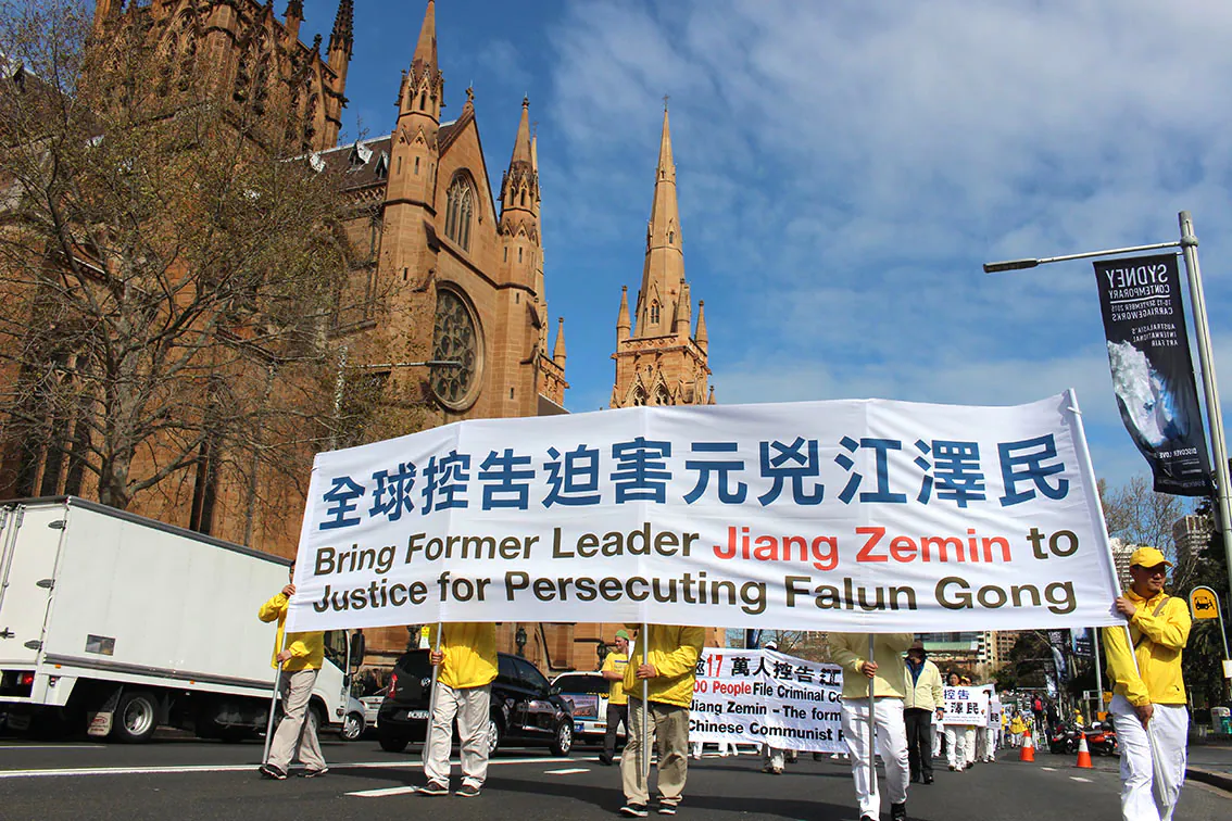 Falun Gong practitioners march in a parade in Sydney on Sept. 4, 2015, calling for an end to the persecution launched by the former Communist Party leader Jiang Zemin. (Epoch Times)