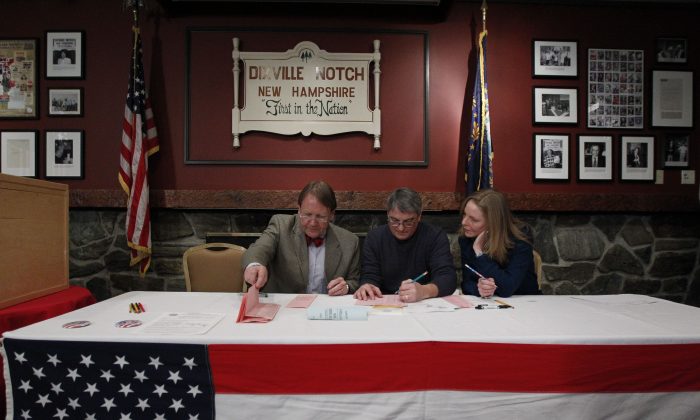 From left, Tom Tillotson, Rick Erwin, and Donna Kaye Erwin count ballots cast after midnigh in the first-in-the-nation presidential primary, at The Balsams Grand Resort, Tuesday, Jan. 10, 2012, in Dixville, N.H. (AP Photo/Matt Rourke)