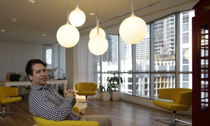Philippe Houdard, co-founder of Pipeline, a shared workspace company, poses for a photograph in the lobby of Pipeline, in downtown Miami on Aug. 11. (AP Photo/Lynne Sladky)