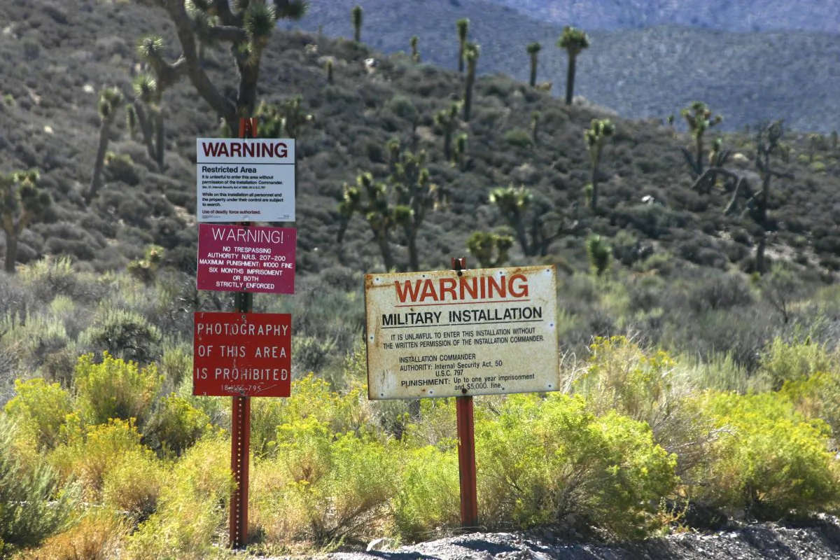 The warning signs on the road leading into Groom Lake, aka Area 51. (LPETTET/iStock)