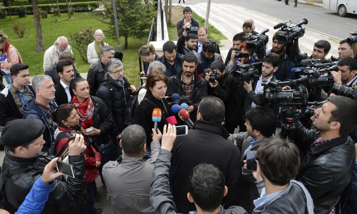 Dutch journalist Frederike Geerdink (C) answers journalists' questions as she leaves Diyarbakir courthouse on April 8, 2015, in Diyarbakir. (Ilyas Akengin/AFP/Getty Images)