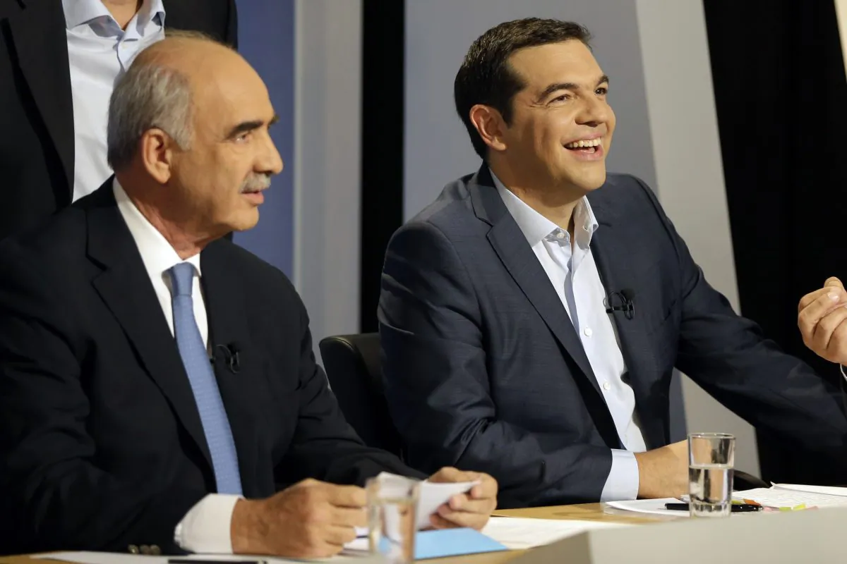 The leader of the left-wing Syriza party and former Greek Prime Minister Alexis Tsipras laughs as main opposition conservative New Democracy head Vangelis Meimarakis waits for the start of a live televised debate at the state-run ERT television in Athens, Wednesday, Sept. 9, 2015. (AP Photo/Thanassis Stavrakis)