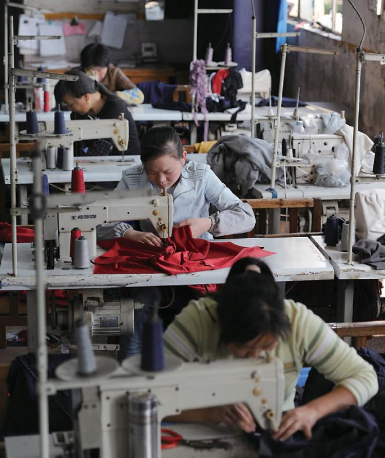 Women in China working for a Taiwanese Company. Taiwanese businesses in China have been hit hard by labor shortages and rising labor costs. (AFP/Getty Images) Women in China working for a Taiwanese Company. Taiwanese businesses in China have been hit hard by labor shortages and rising labor costs. (AFP/Getty Images)