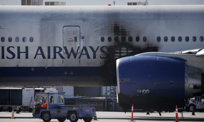 A damaged British Airways Boeing 777-200 sits at McCarran International Airport Wednesday, Sept. 9, 2015, in Las Vegas. (AP Photo/John Locher)