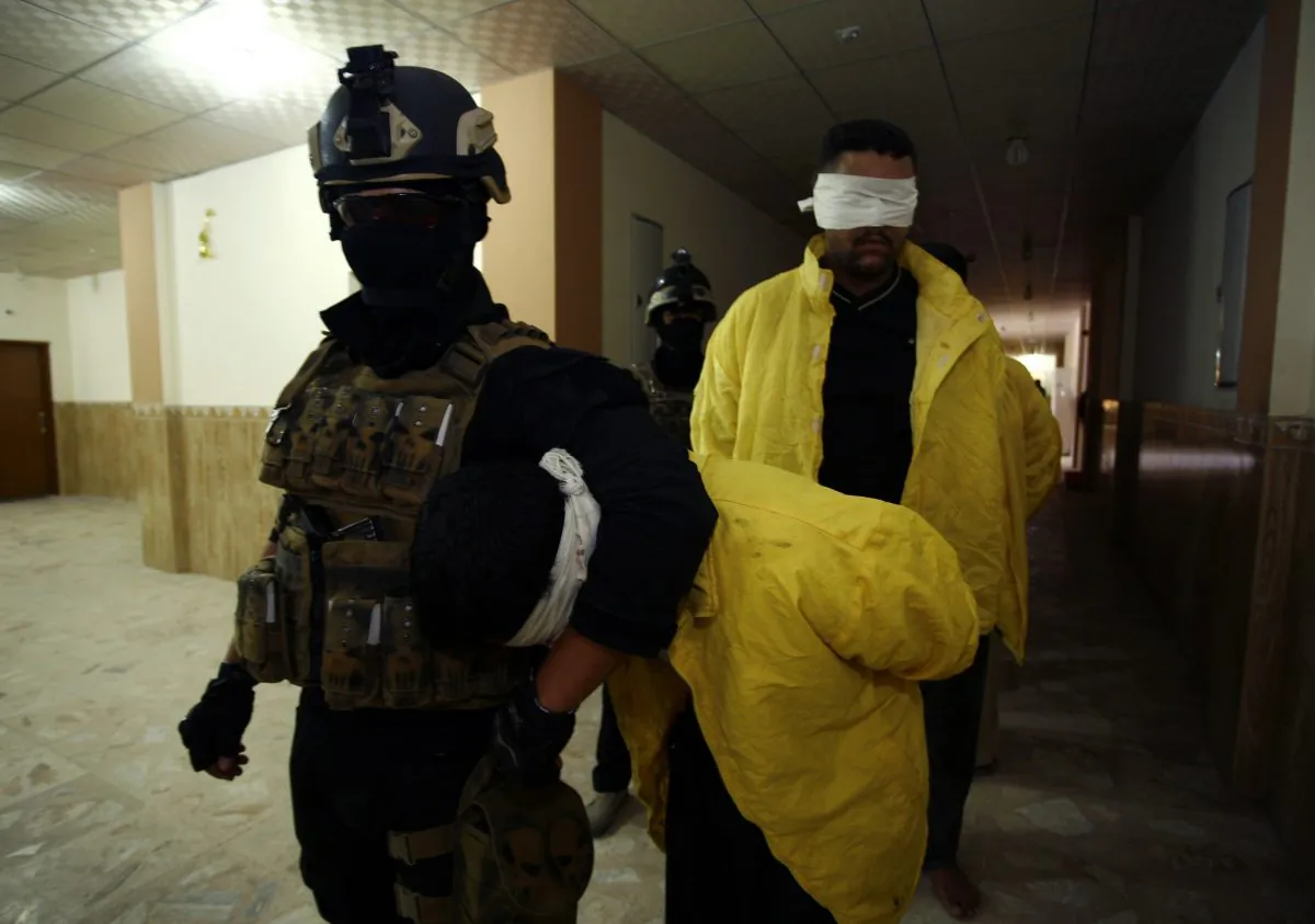 Iraqi special forces arrest men suspected of belonging to the ISIS terrorist organization in Najaf on July 22. Hackers have leaked the phone numbers and home addresses of ISIS recruiters. (Haidar Hamdani/AFP/Getty Images)