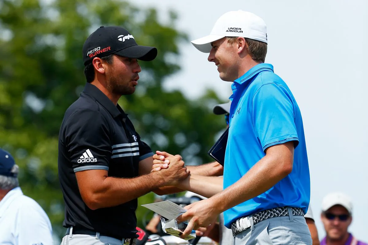 Jason Day of Australia (L) greets Jordan Spieth of the United States on the first tee during the final round of the 2015 PGA Championship at Whistling Straits on August 16, in Sheboygan, Wisconsin. (Jamie Squire/Getty Images) 