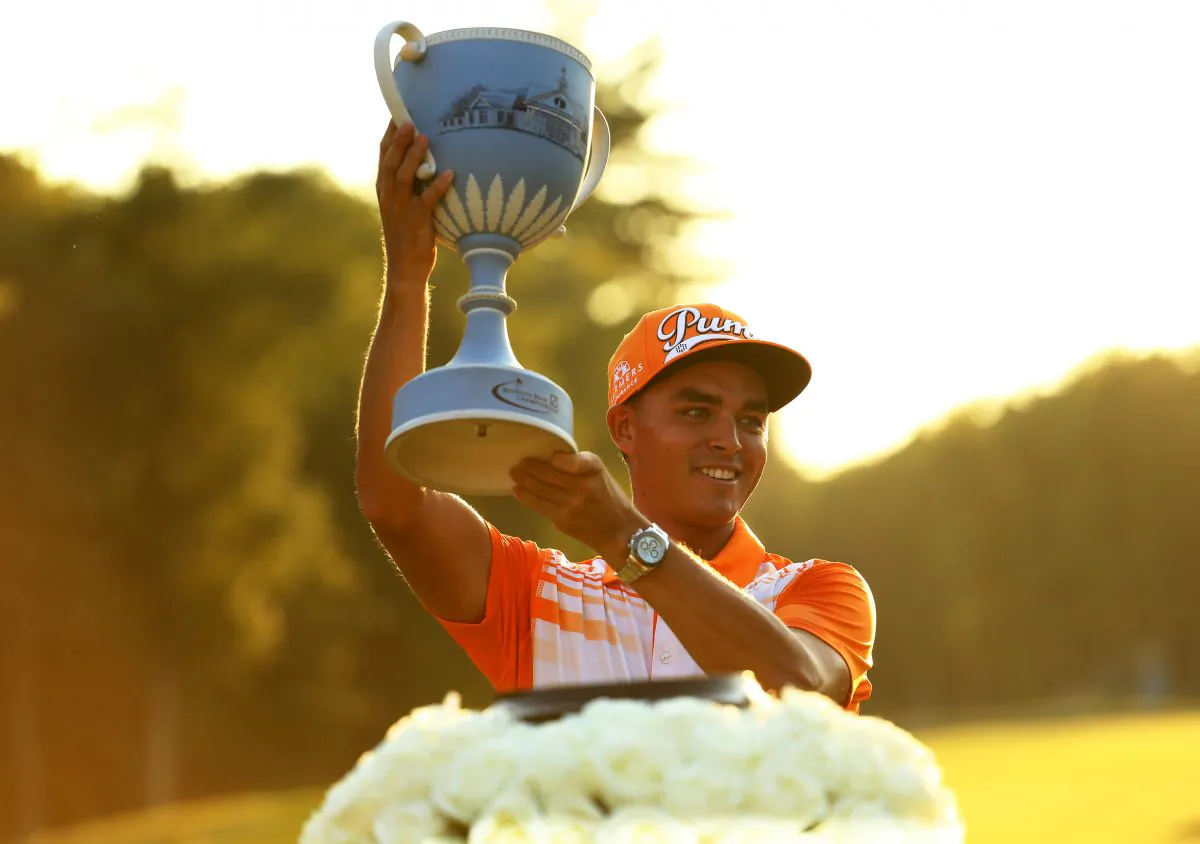 Rickie Fowler raises the winners trophy at the Deutsche Bank Championship at TPC Boston on September 7, in Norton, Massachusetts. (Maddie Meyer/Getty Images)