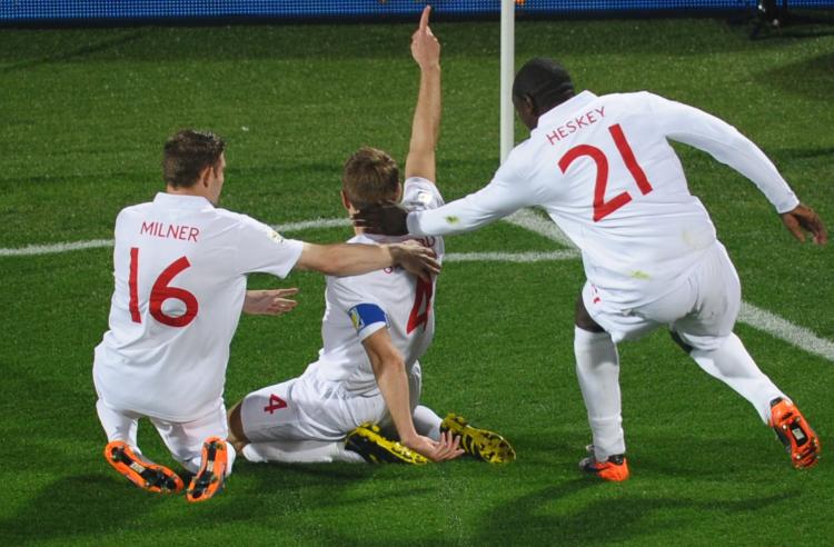 England's midfielder Steven Gerrard (C) celebrates with teammates after scoring against the USA. (HOANG DINH NAM/AFP/Getty Images)
