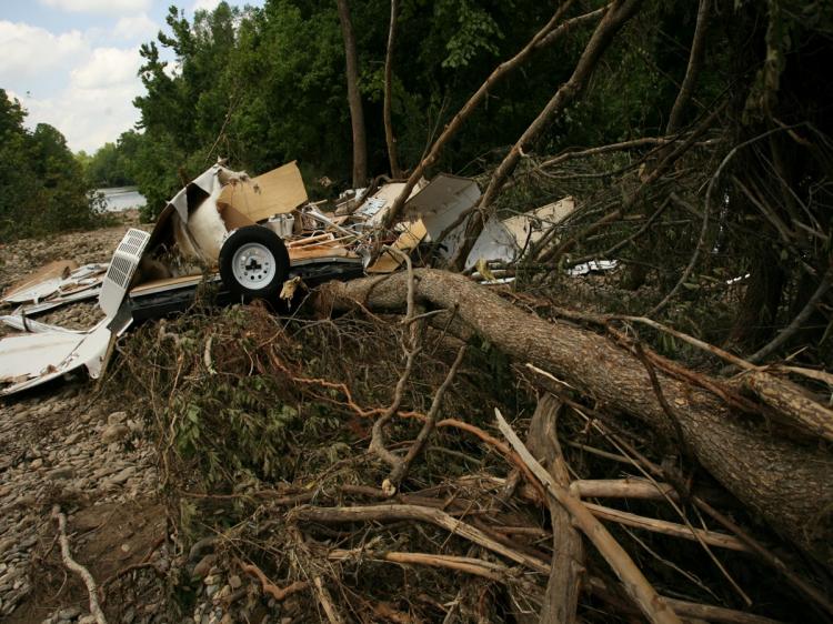 A destroyed camper rests on a pile of downed trees in the aftermath of a flash flood on Caddo River June 13 in Caddo Gap, Arkansas. National Flood Specialist with the USGS, Dr. Robert Holmes said campers need to be cautious when choosing campsites and sho (David Yerby/Getty Images) A destroyed camper rests on a pile of downed trees in the aftermath of a flash flood on Caddo River June 13 in Caddo Gap, Arkansas. National Flood Specialist with the USGS, Dr. Robert Holmes said campers need to be cautious when choosing campsites and sho (David Yerby/Getty Images)