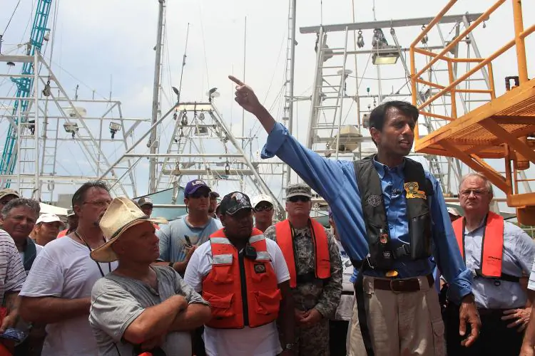 Louisiana Governor Bobby Jindal speaks with workers, mainly fisherman, involved in the clean-up effort of the BP oil spill on a command post boat in Barataria Bay on June 15, 2010, off of Grand Isle, Louisiana. (Spencer Platt/Getty Images)